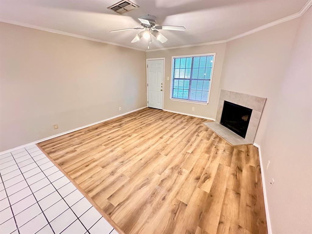 2215 Post Road, Unit 1010 Austin, TX 78704 - Photo 17 of 25 a bedroom with a bed and a flat tv screen