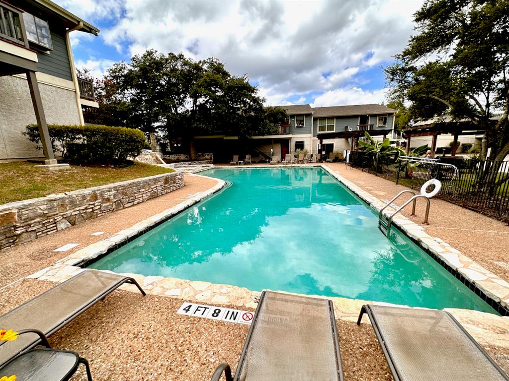 2215 Post Road, Unit 1010 Austin, TX 78704 - Photo 21 of 25 a view of a swimming pool with a patio