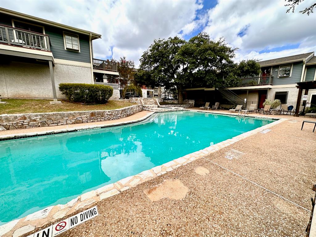 2215 Post Road, Unit 1010 Austin, TX 78704 - Photo 22 of 25 a view of a house with a swimming pool