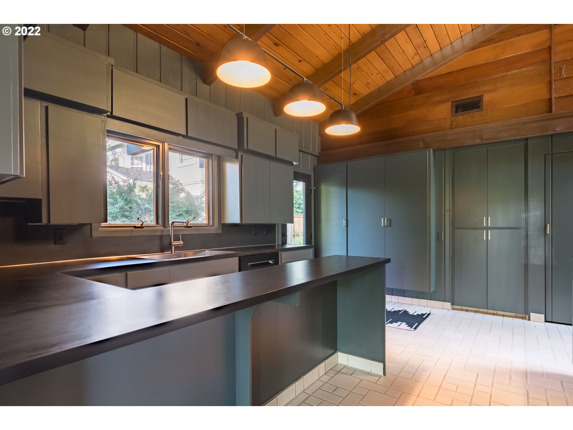 2000 University Street Eugene, OR 97403 - Photo 12 of 32 a kitchen with stainless steel appliances a sink and cabinets