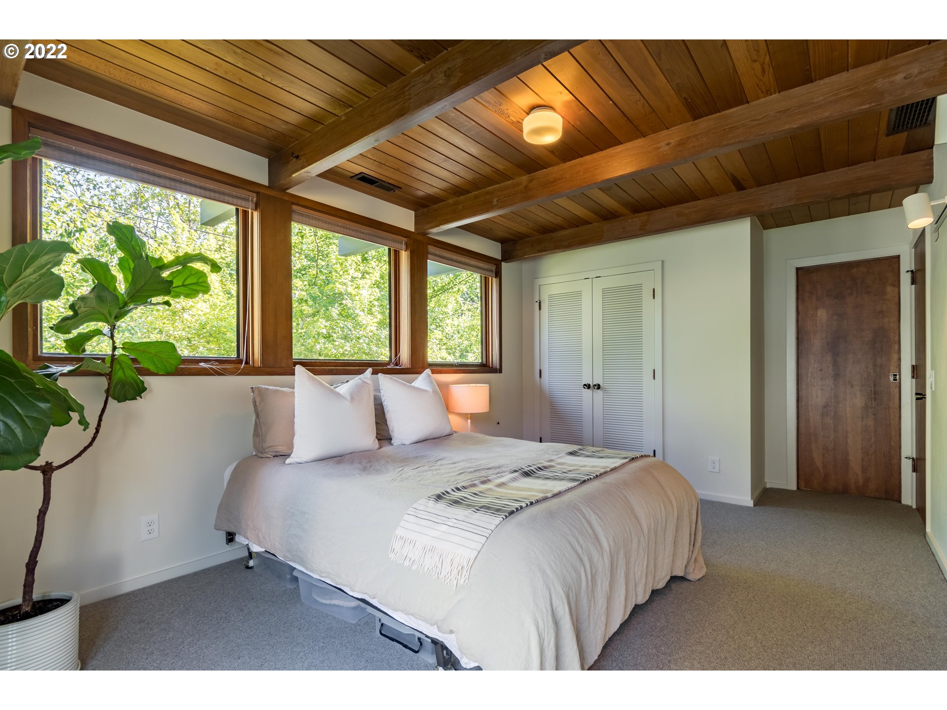 2000 University Street Eugene, OR 97403 - Photo 18 of 32 a bedroom with a large bed and a large window