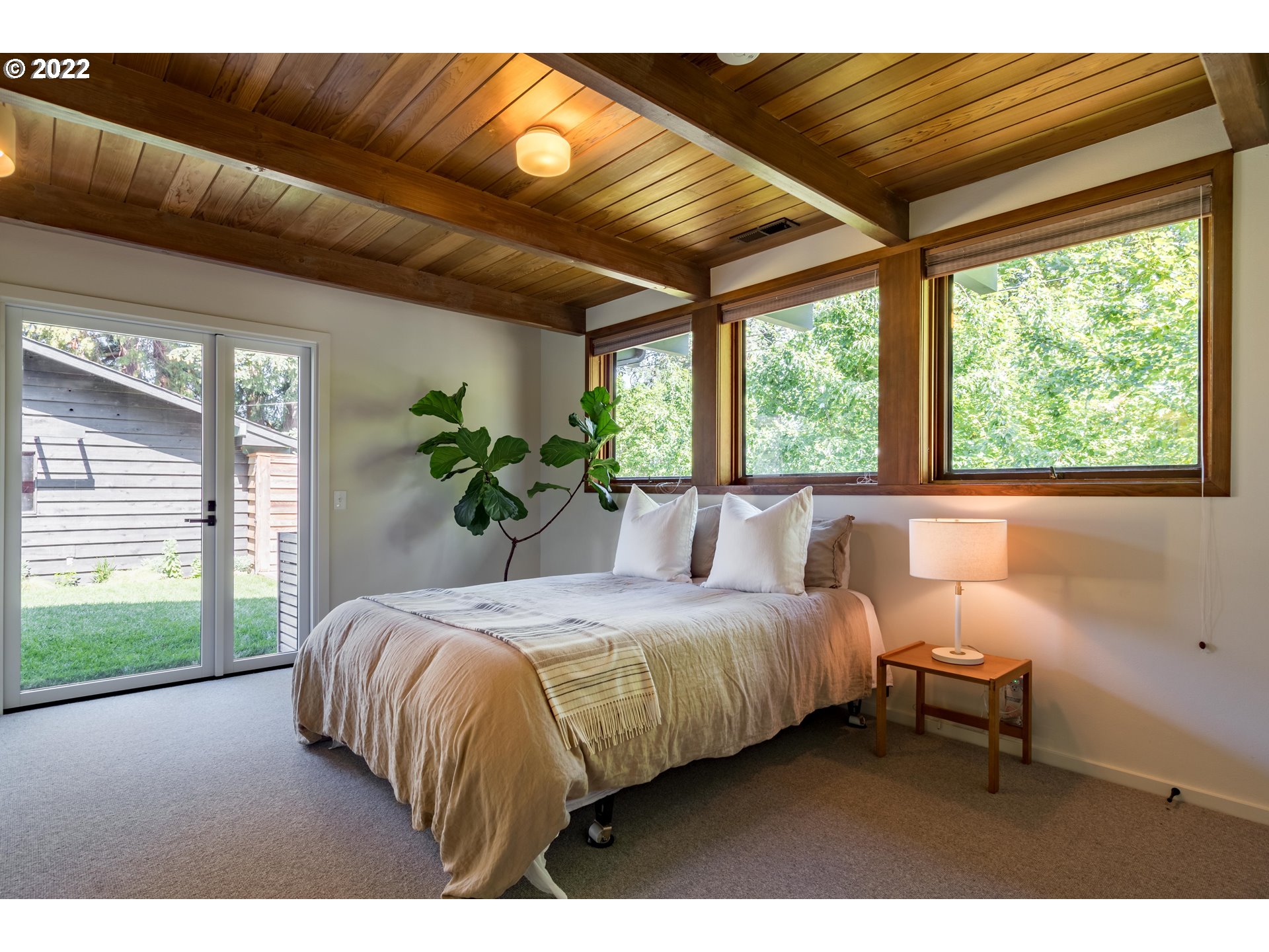 2000 University Street Eugene, OR 97403 - Photo 19 of 32 a bedroom with a large bed and a large window