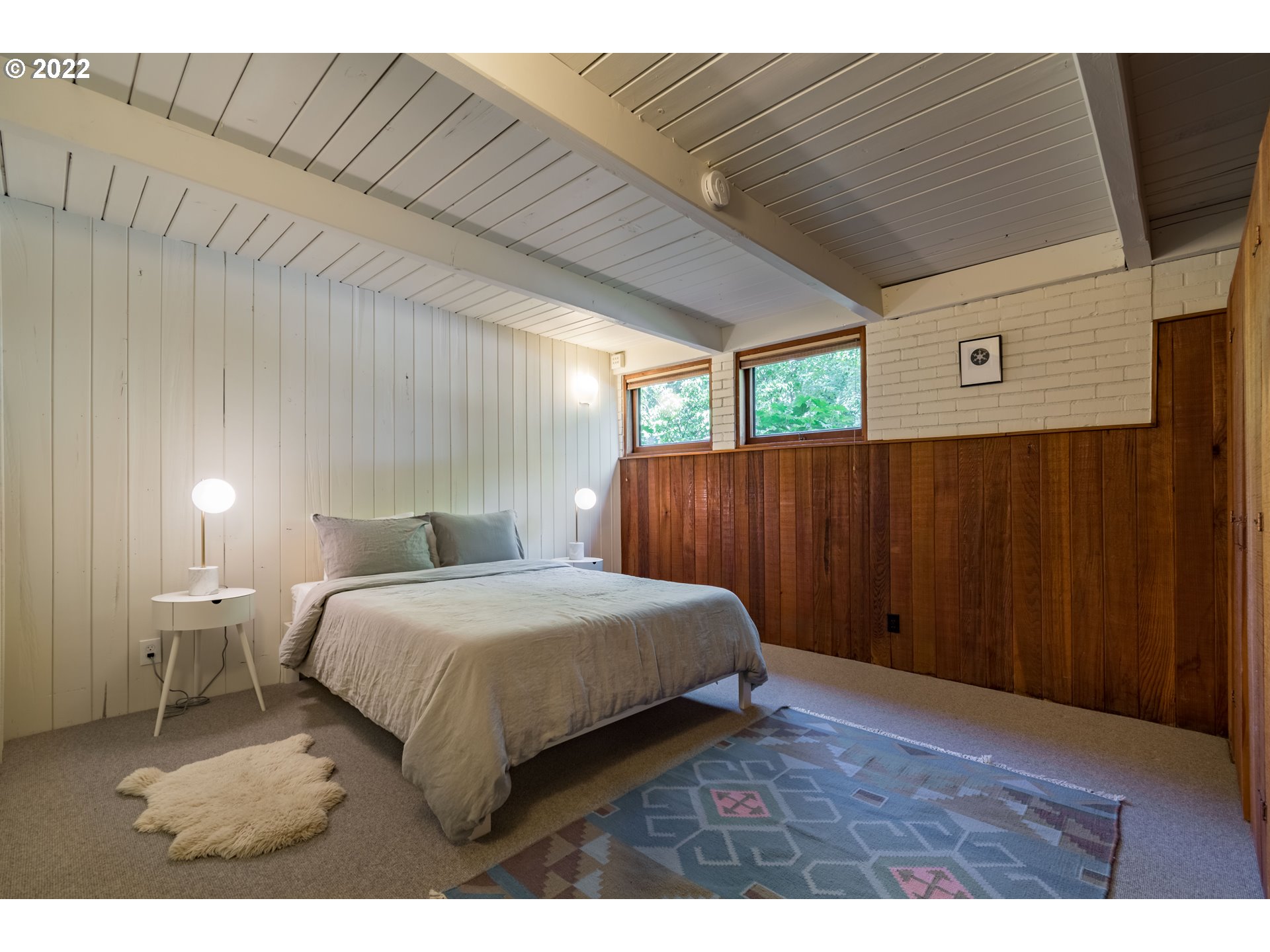 2000 University Street Eugene, OR 97403 - Photo 24 of 32 a bedroom with a bed and a night stand