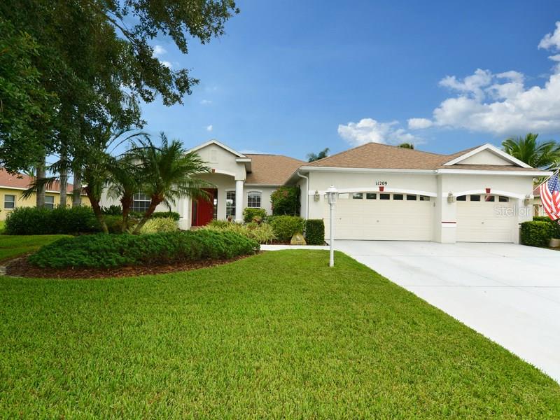 11209 Rivers Bluff Circle Lakewood Ranch, FL 34202 - Photo 1 of 1 a front view of a house with a yard and garage
