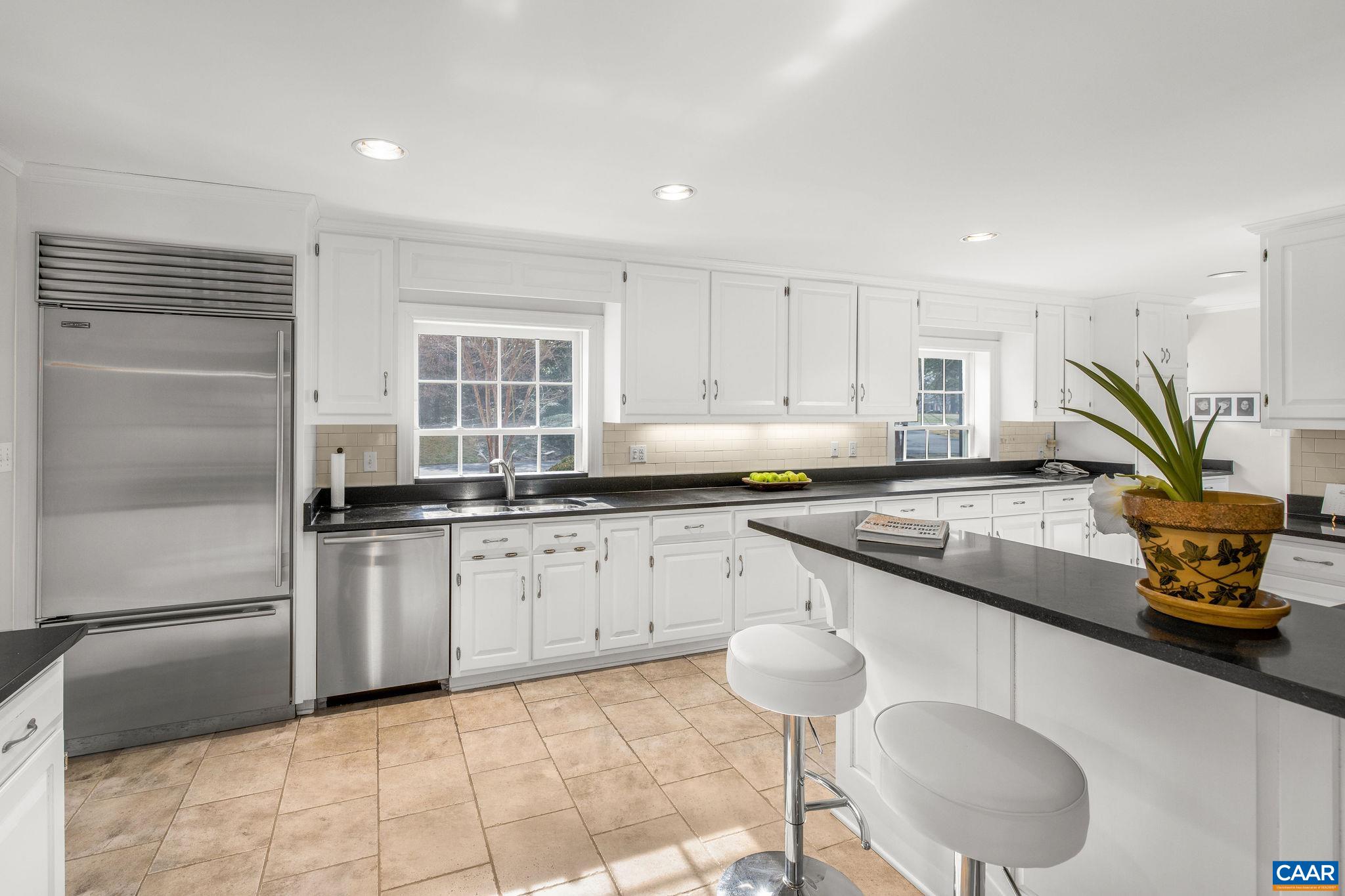 2418 Northfield Road Charlottesville, VA 22901 - Photo 12 of 47 a kitchen with stainless steel appliances granite countertop a sink and a stove