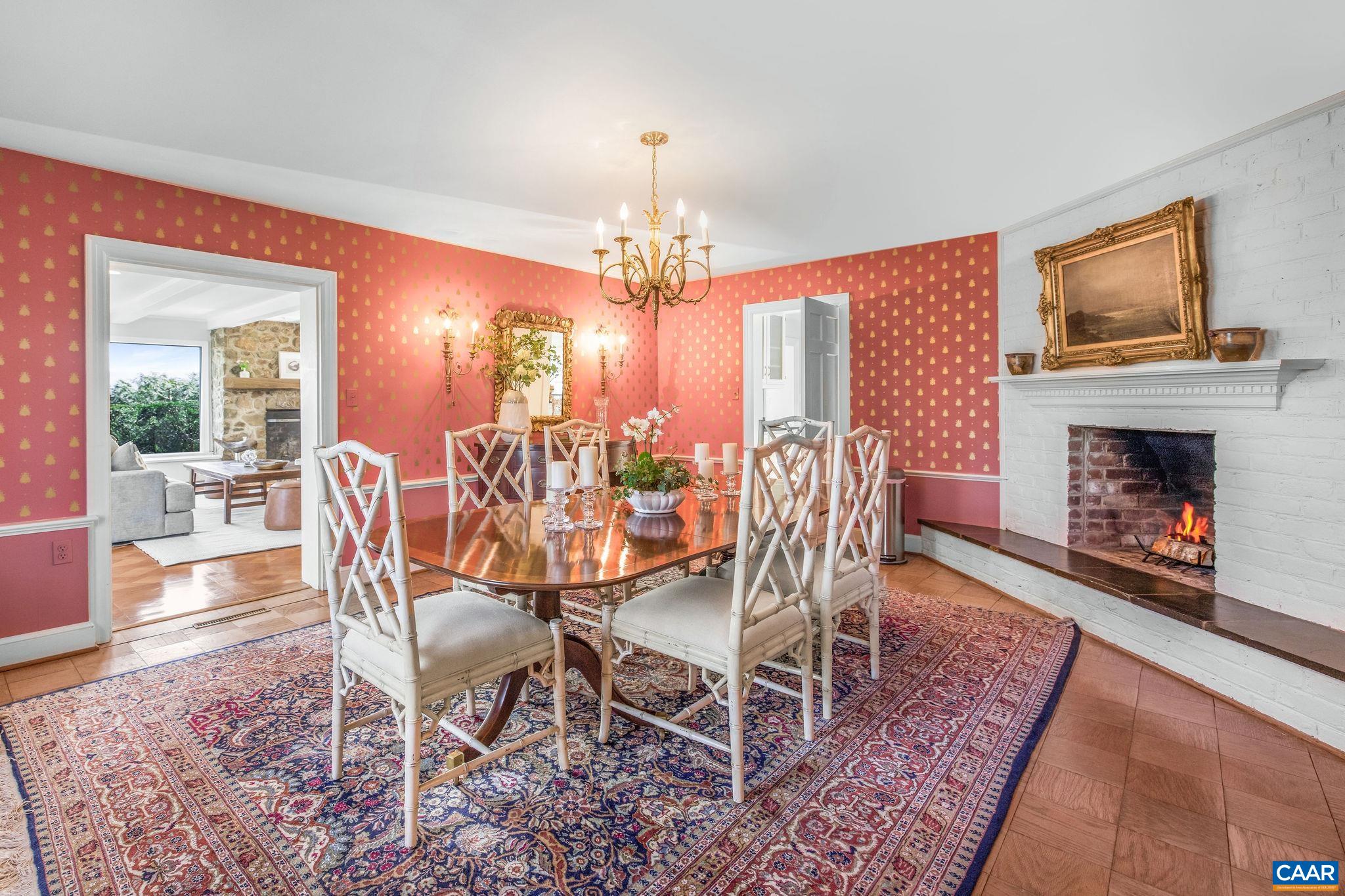 2418 Northfield Road Charlottesville, VA 22901 - Photo 13 of 47 a dining room with furniture a chandelier and wooden floor