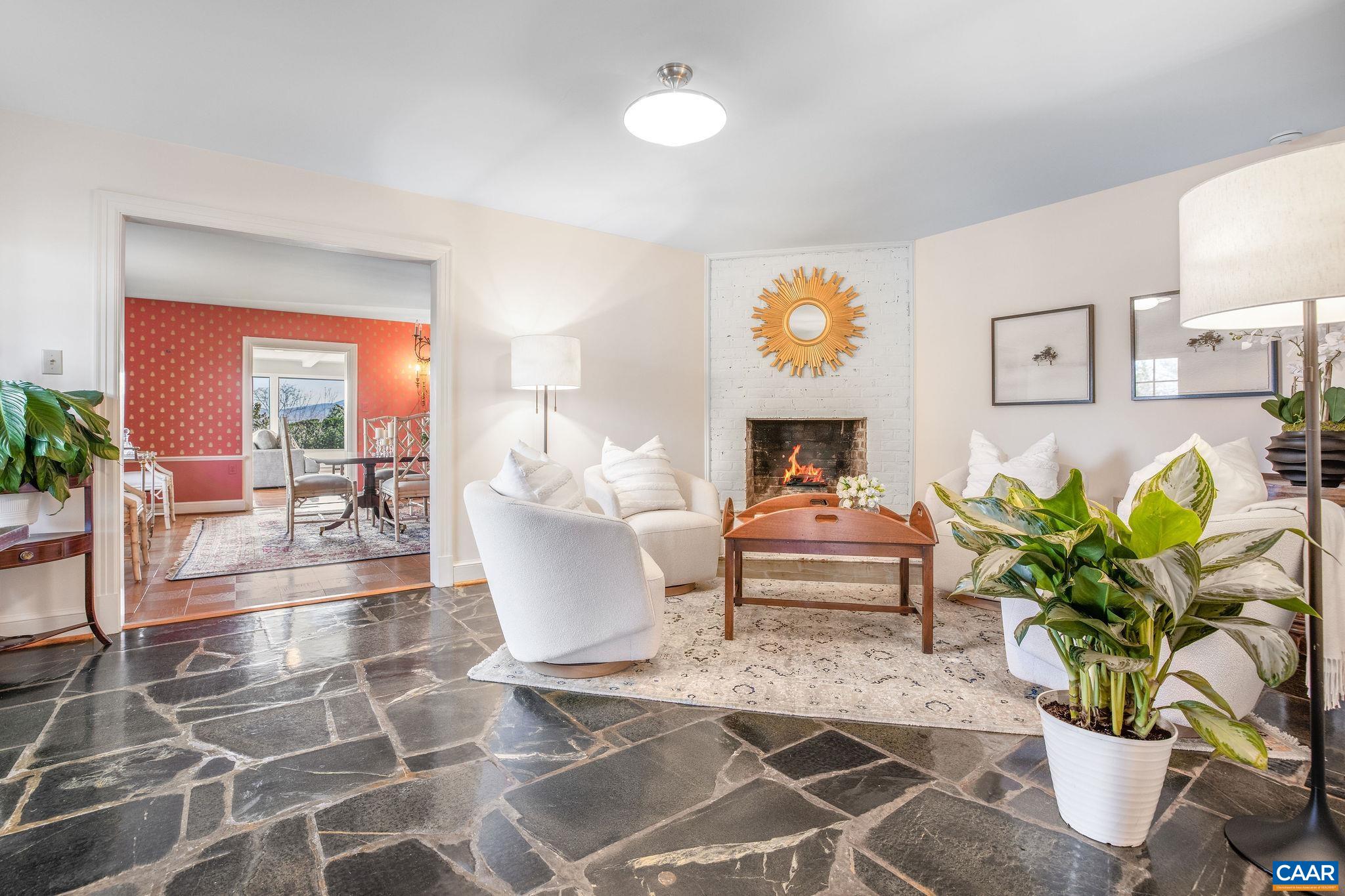 2418 Northfield Road Charlottesville, VA 22901 - Photo 17 of 47 a living room with patio furniture and a potted plant
