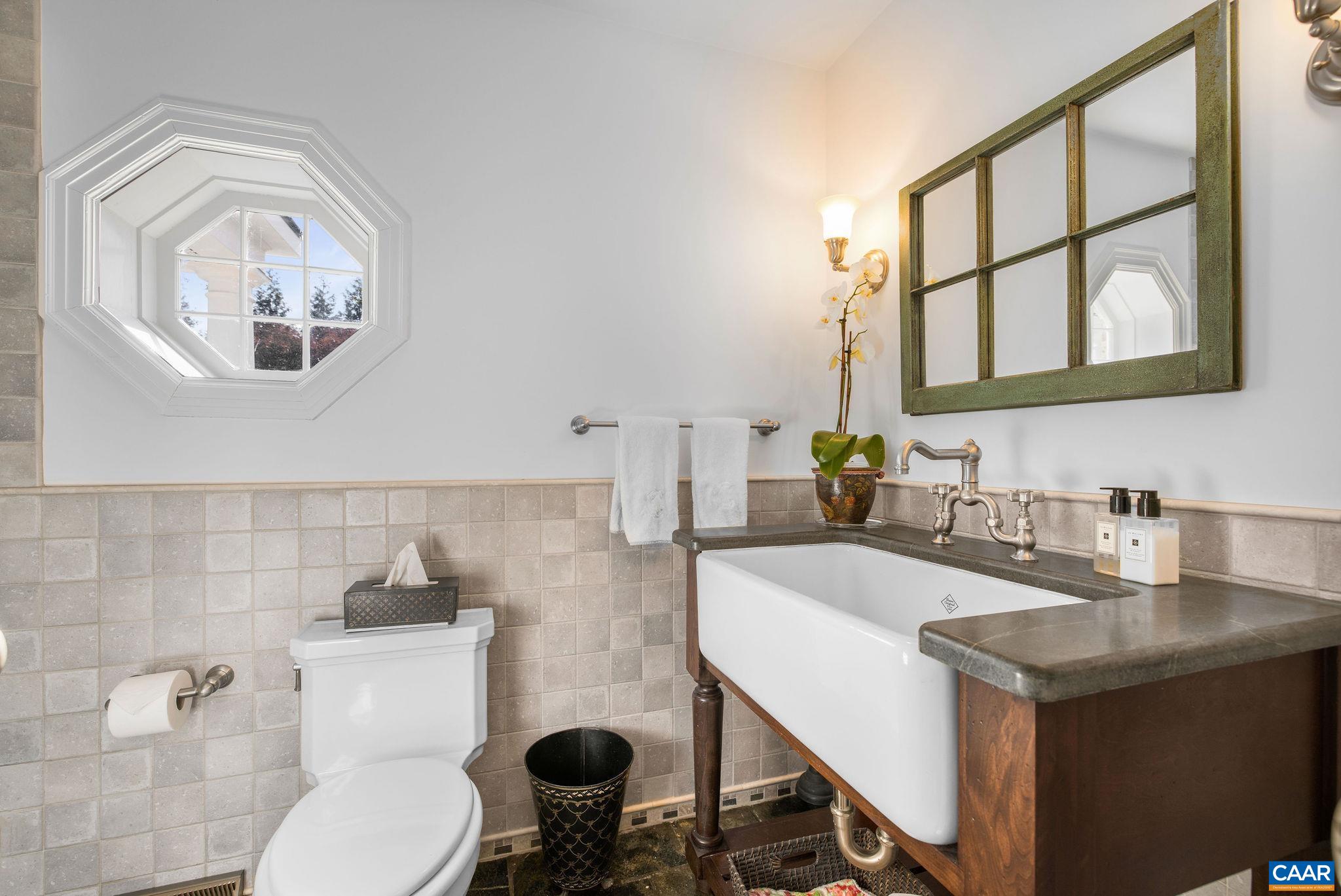 2418 Northfield Road Charlottesville, VA 22901 - Photo 19 of 47 a bathroom with a toilet a sink and a mirror