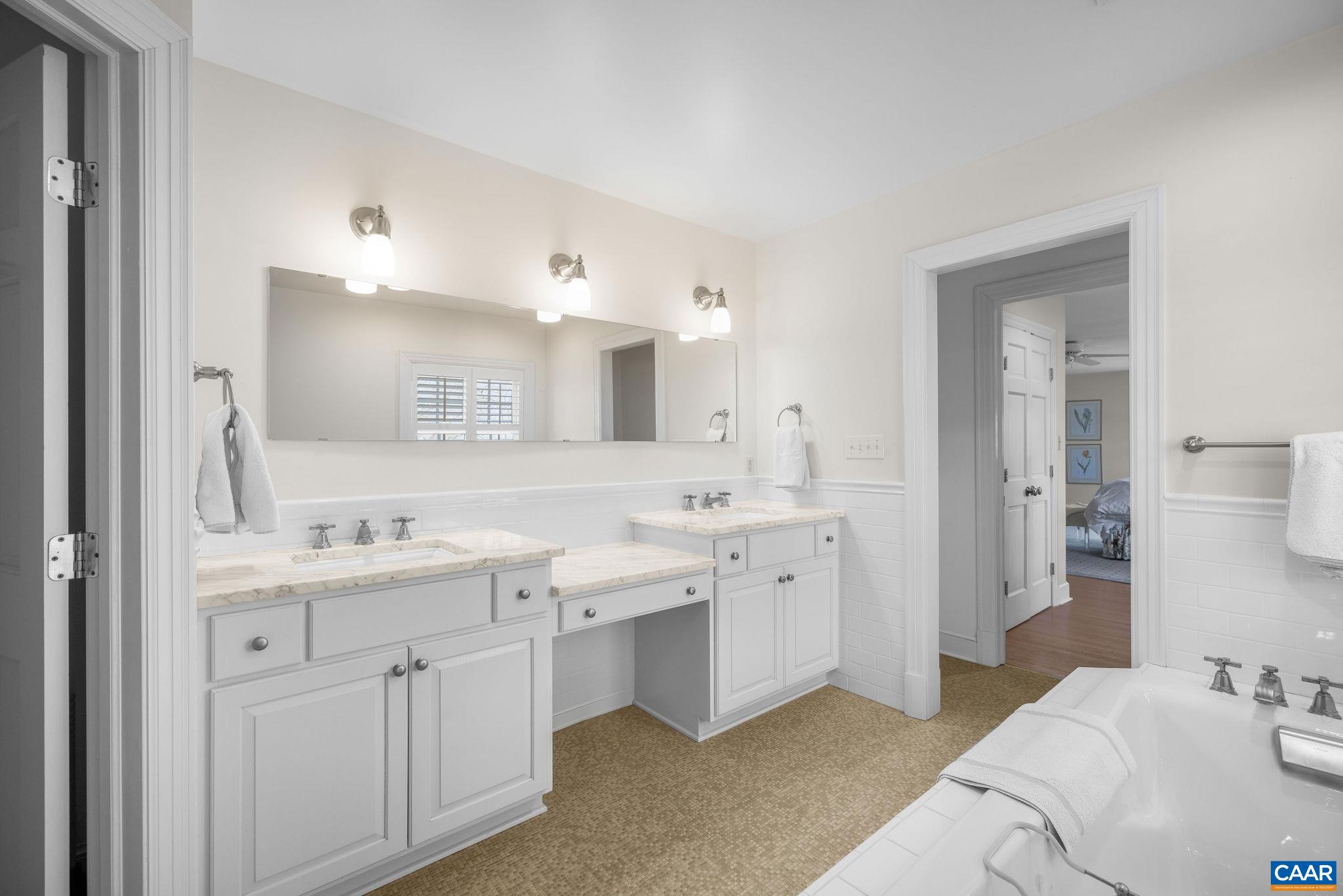 2418 Northfield Road Charlottesville, VA 22901 - Photo 24 of 47 a spacious bathroom with a double vanity sink mirror and