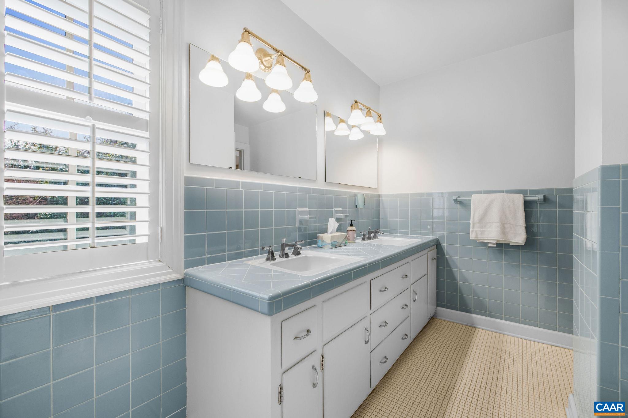 2418 Northfield Road Charlottesville, VA 22901 - Photo 26 of 47 a bathroom with a sink vanity and a mirror