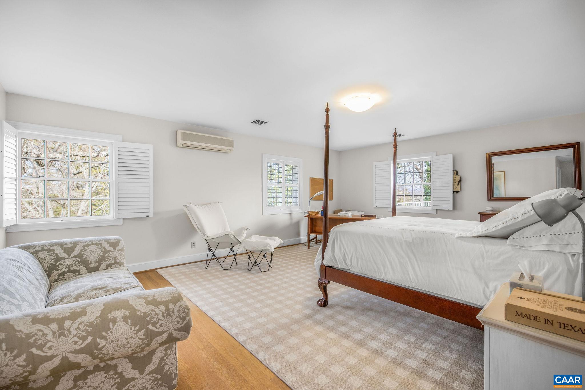 2418 Northfield Road Charlottesville, VA 22901 - Photo 27 of 47 a spacious bedroom with a bed and window