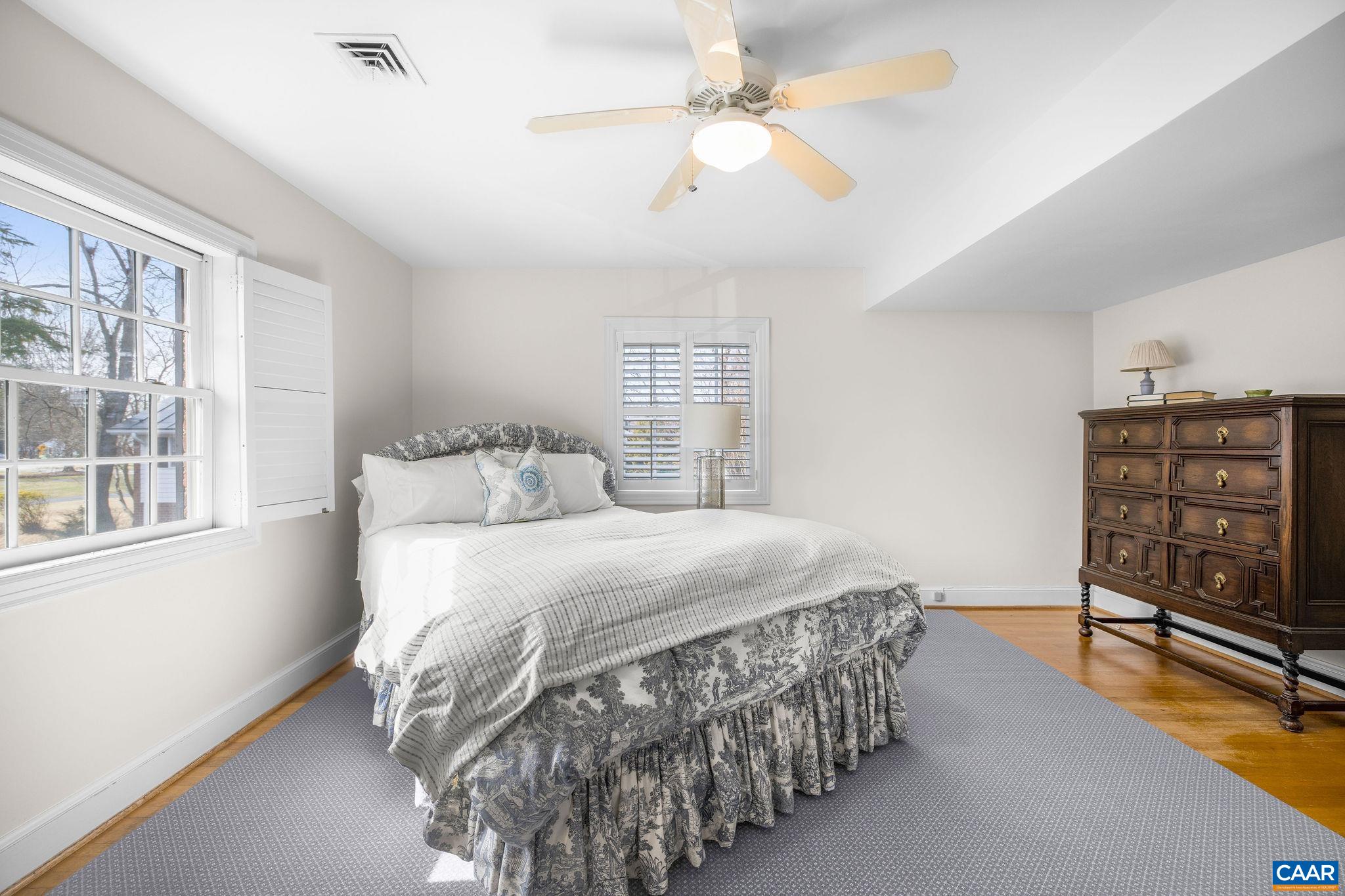 2418 Northfield Road Charlottesville, VA 22901 - Photo 28 of 47 a bedroom with a bed a chandelier and closet