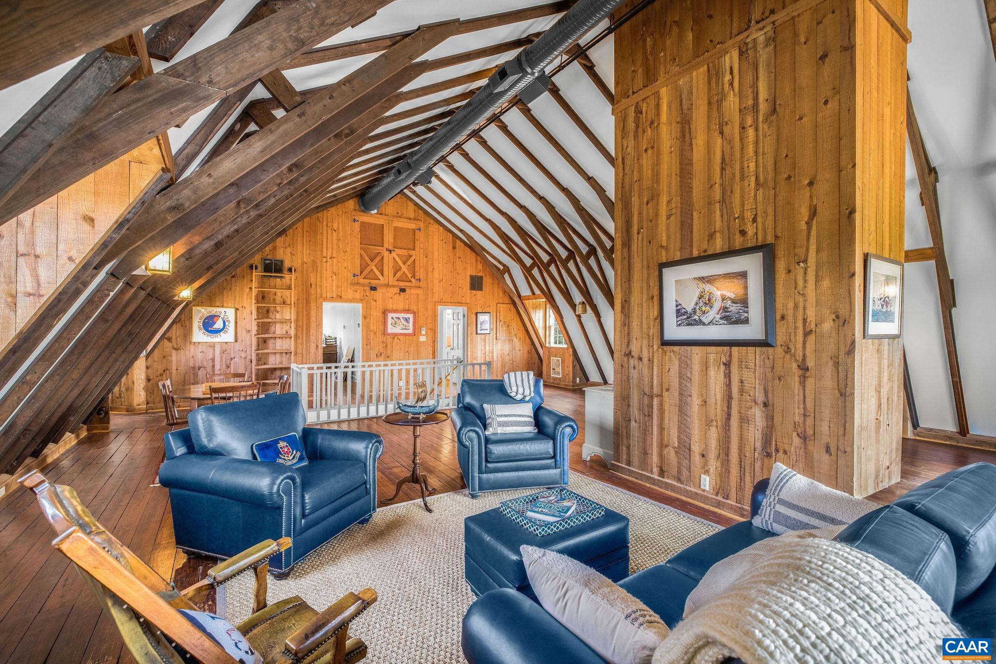 2418 Northfield Road Charlottesville, VA 22901 - Photo 32 of 47 a living room with furniture and a floor to ceiling window