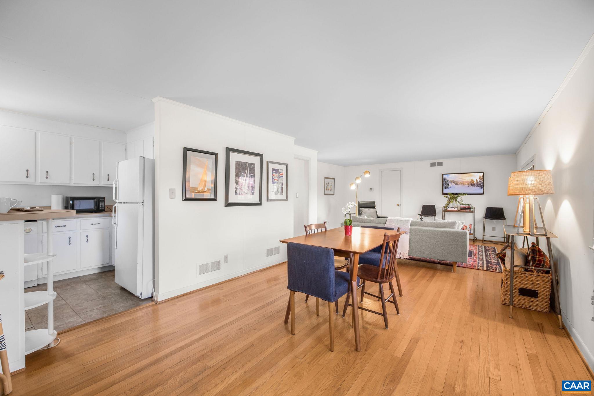 2418 Northfield Road Charlottesville, VA 22901 - Photo 39 of 47 a view of a dining room with furniture and wooden floor