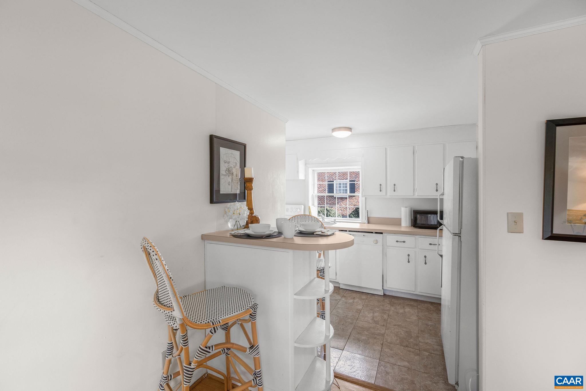 2418 Northfield Road Charlottesville, VA 22901 - Photo 41 of 47 a kitchen with stainless steel appliances a table and chairs
