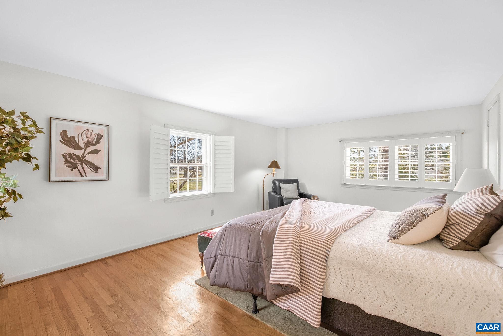 2418 Northfield Road Charlottesville, VA 22901 - Photo 43 of 47 a bedroom with a bed and wooden floor