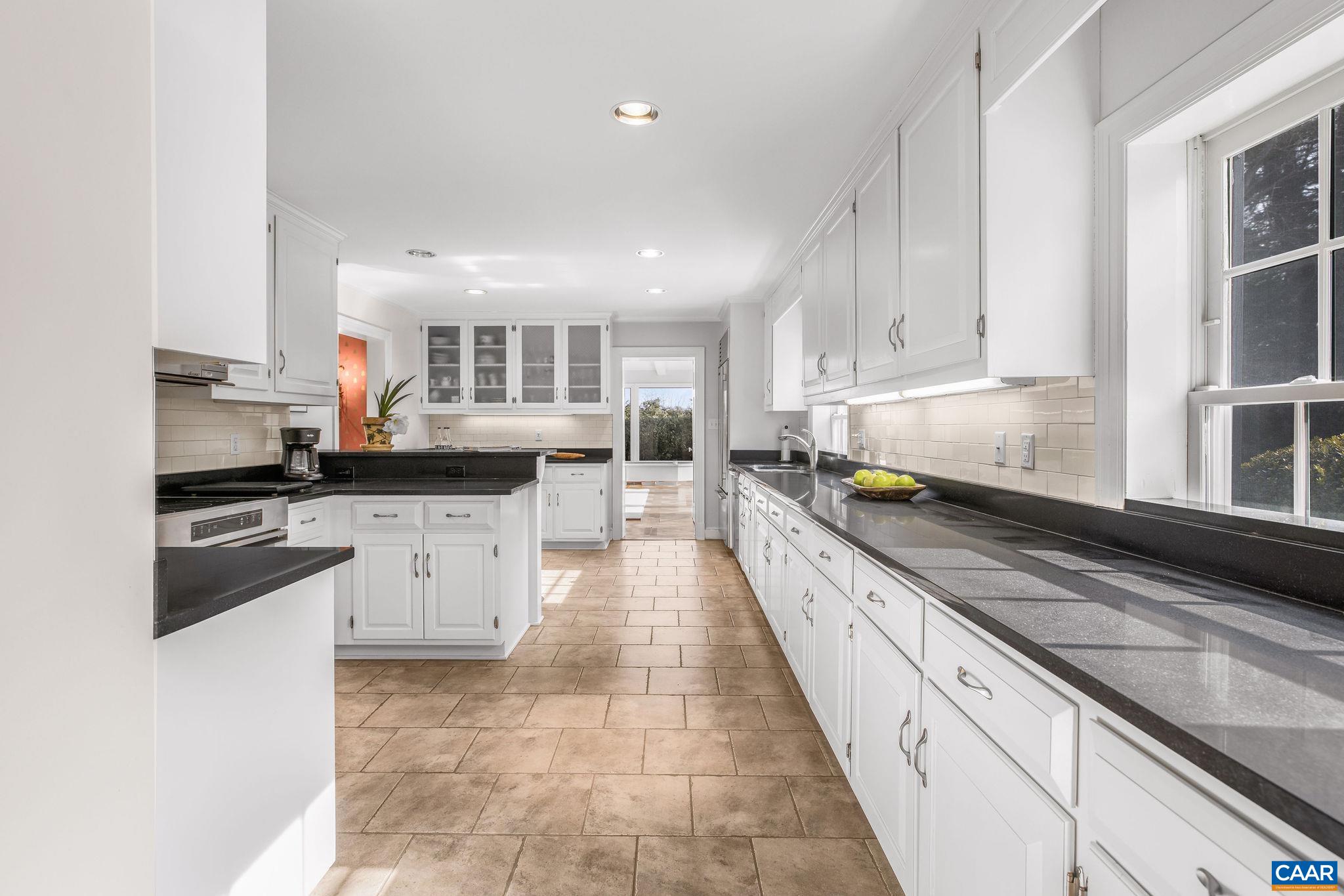 2418 Northfield Road Charlottesville, VA 22901 - Photo 10 of 47 a large kitchen with stainless steel appliances lots of counter space and a sink