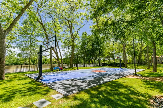 a backyard of a house with barbeque oven table and chairs