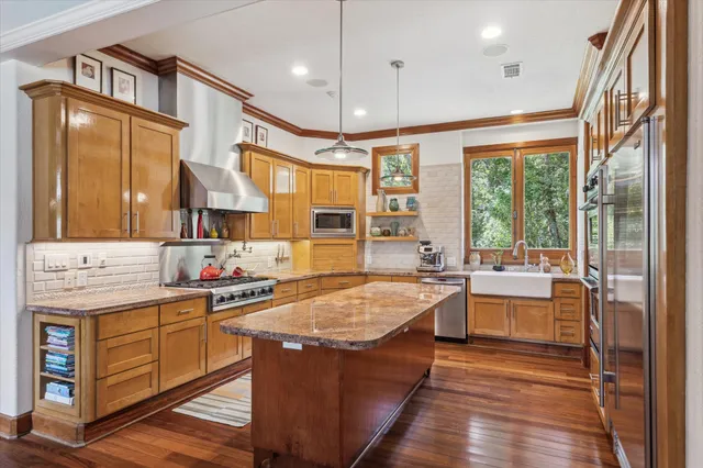 a room with lots of counter and windows