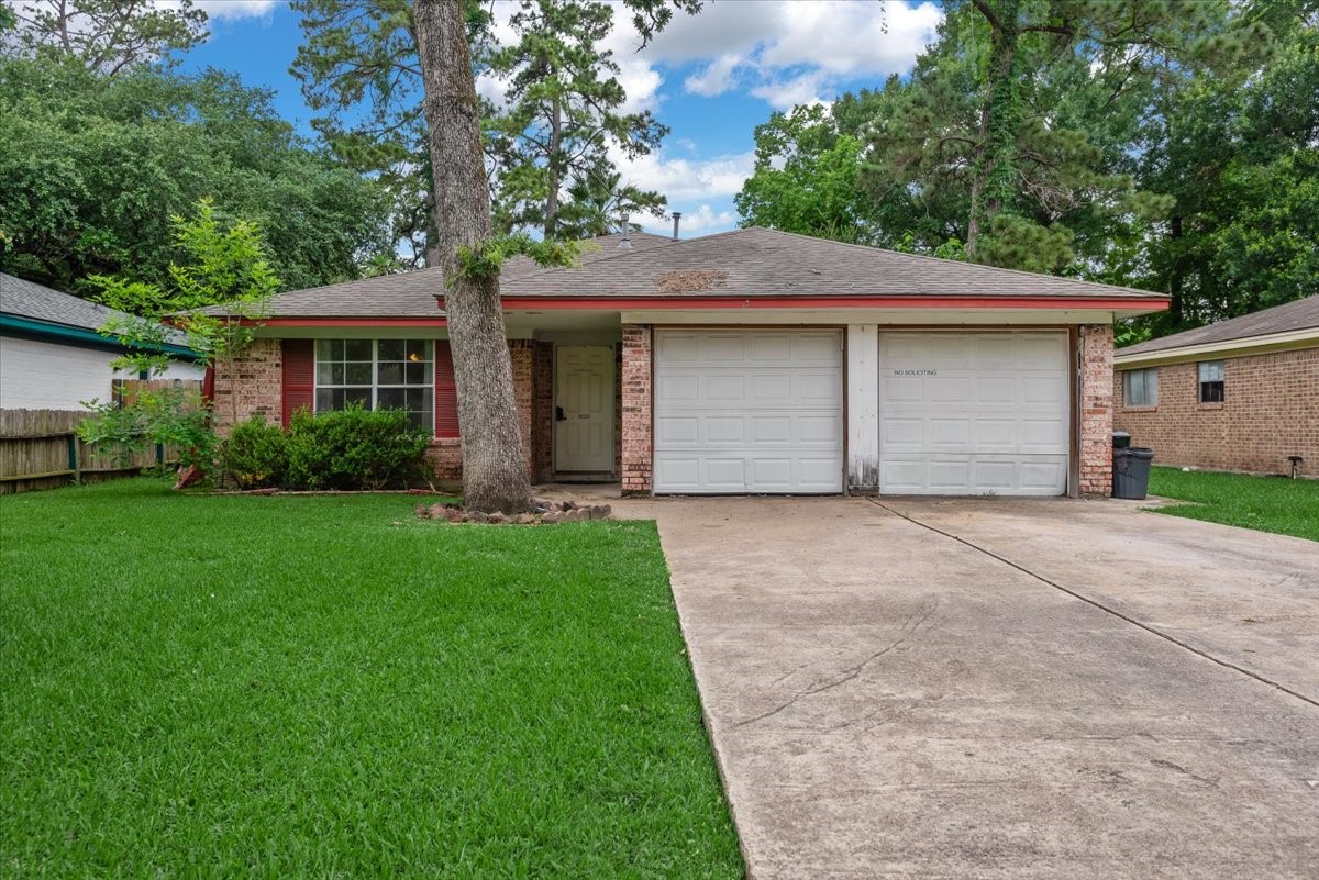 23011 Bayleaf Drive Spring, TX 77373 - Photo 1 of 22 a front view of house with yard and green space