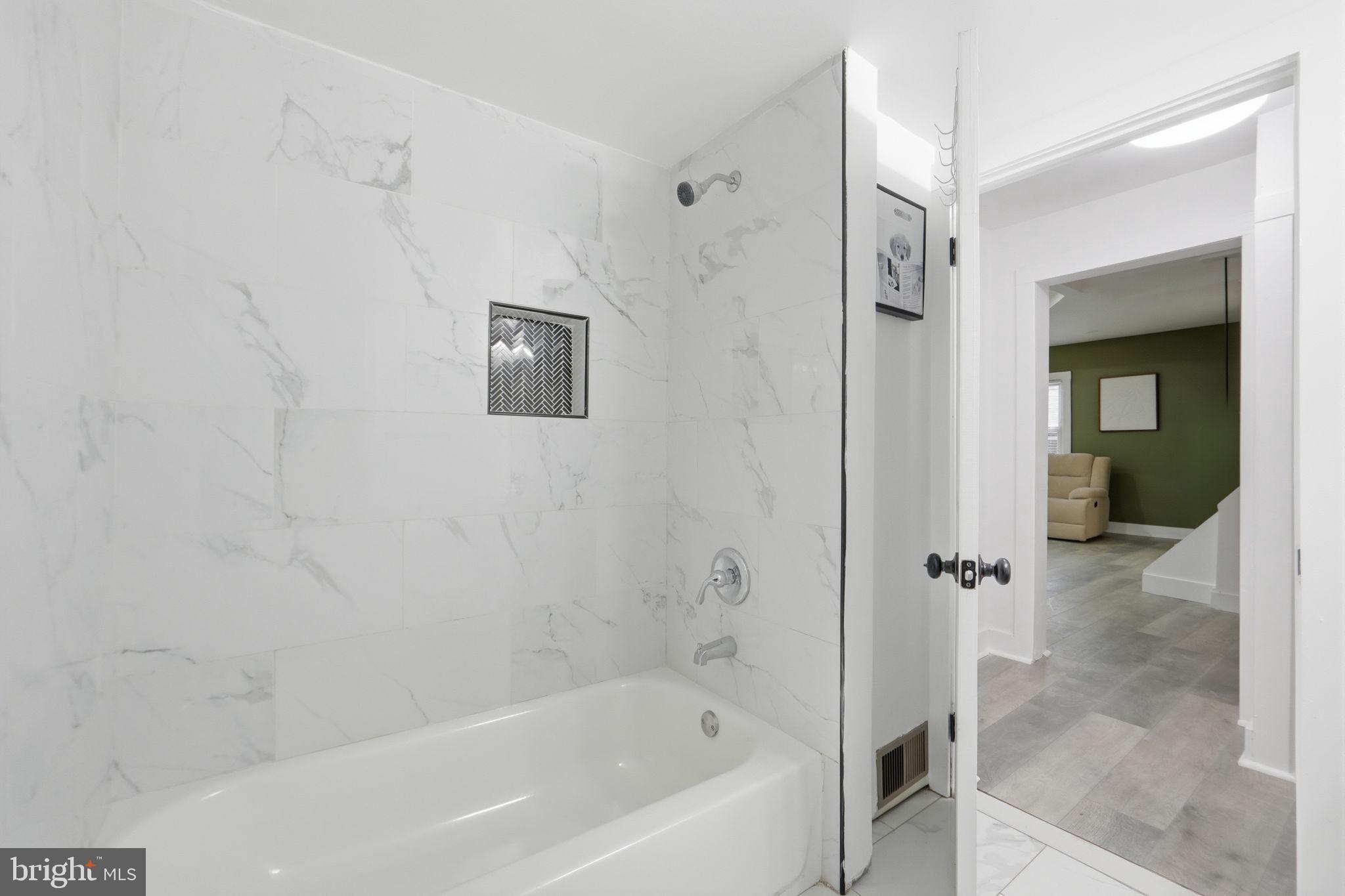 5906 Berwyn Road College Park, MD 20740 - Photo 21 of 46 a bathroom with a bathtub
