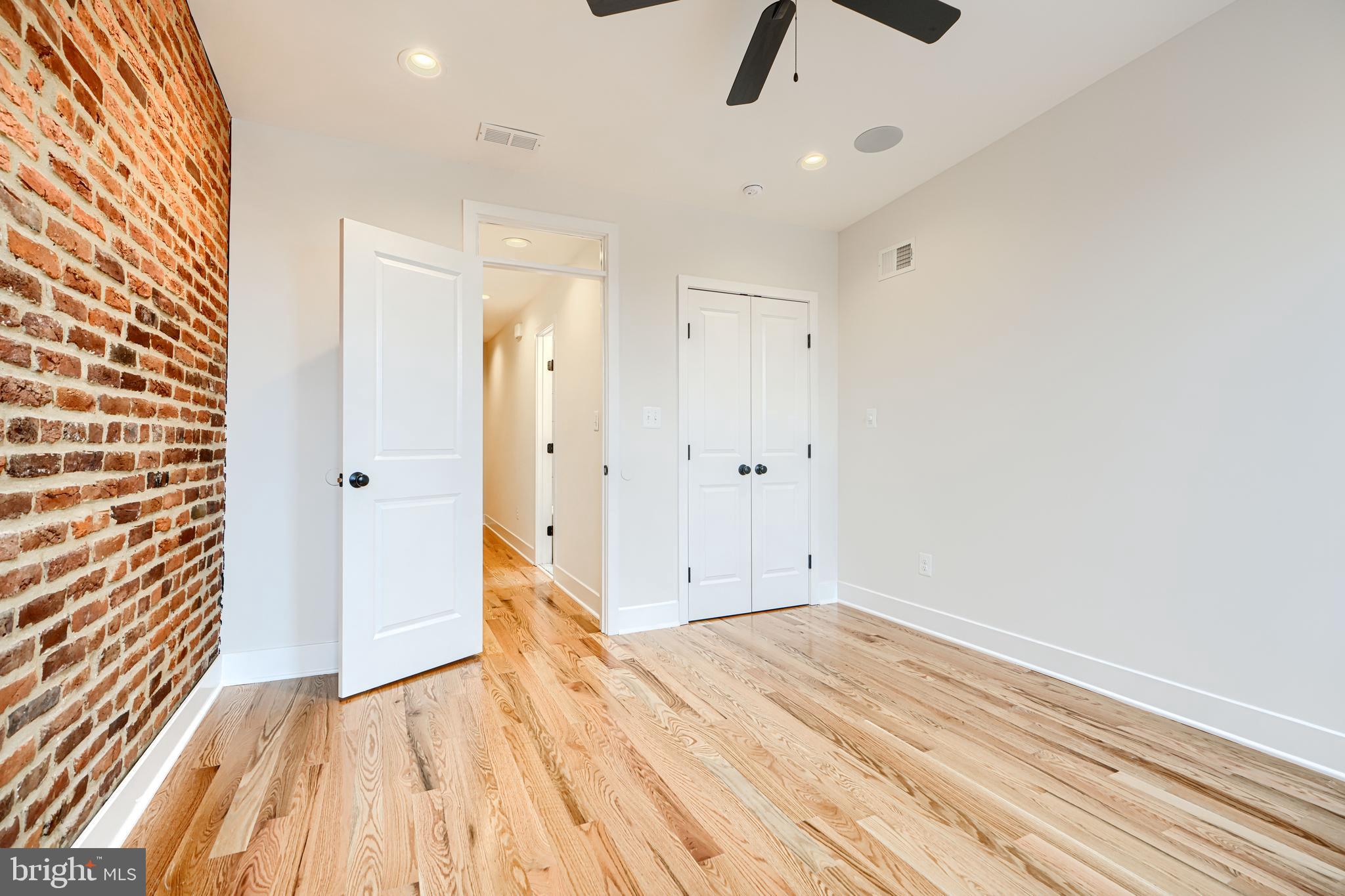 719 South Robinson Street Baltimore, MD 21224 - Photo 20 of 31 wooden floor in an empty room with a window