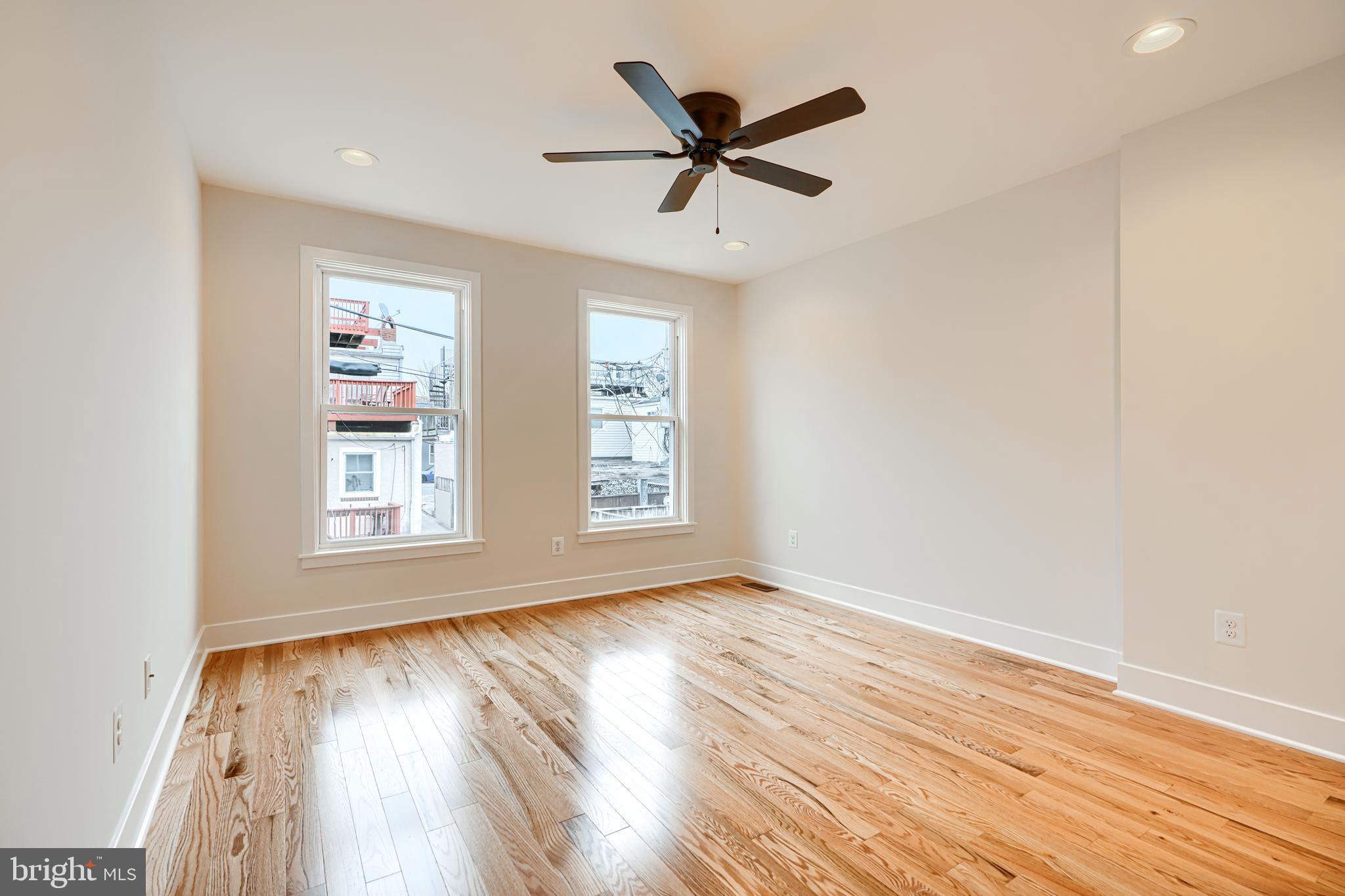 719 South Robinson Street Baltimore, MD 21224 - Photo 23 of 31 a view of empty room with wooden floor and fan