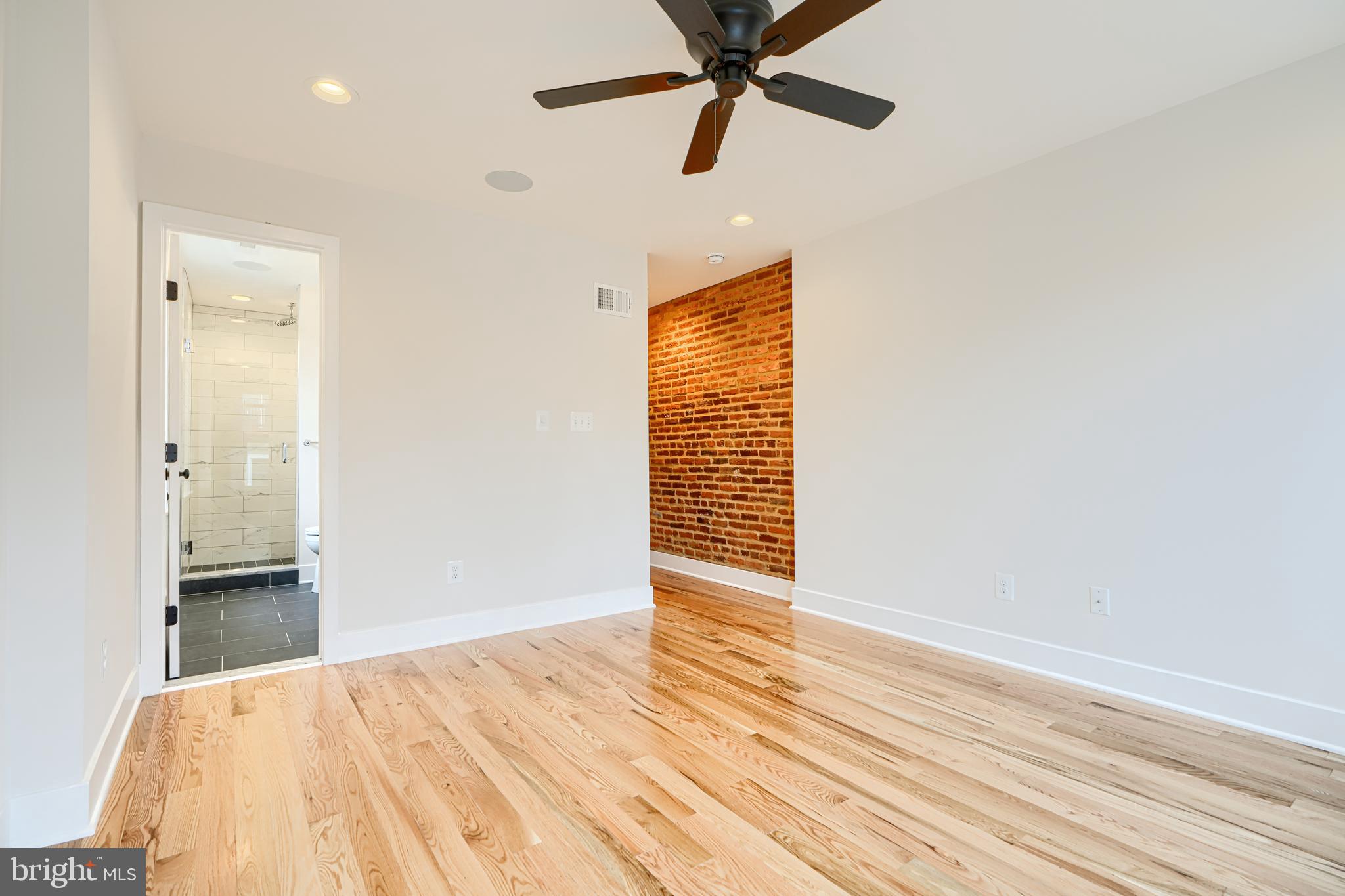 719 South Robinson Street Baltimore, MD 21224 - Photo 25 of 31 a view of an empty room with wooden floor
