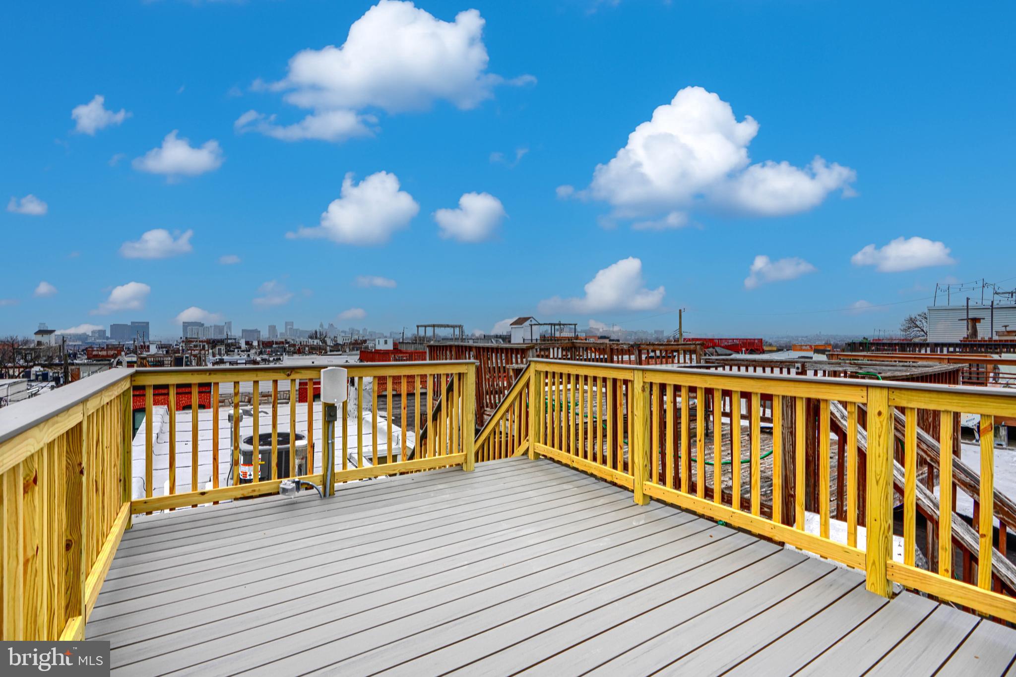 719 South Robinson Street Baltimore, MD 21224 - Photo 30 of 31 a view of a balcony with wooden floor