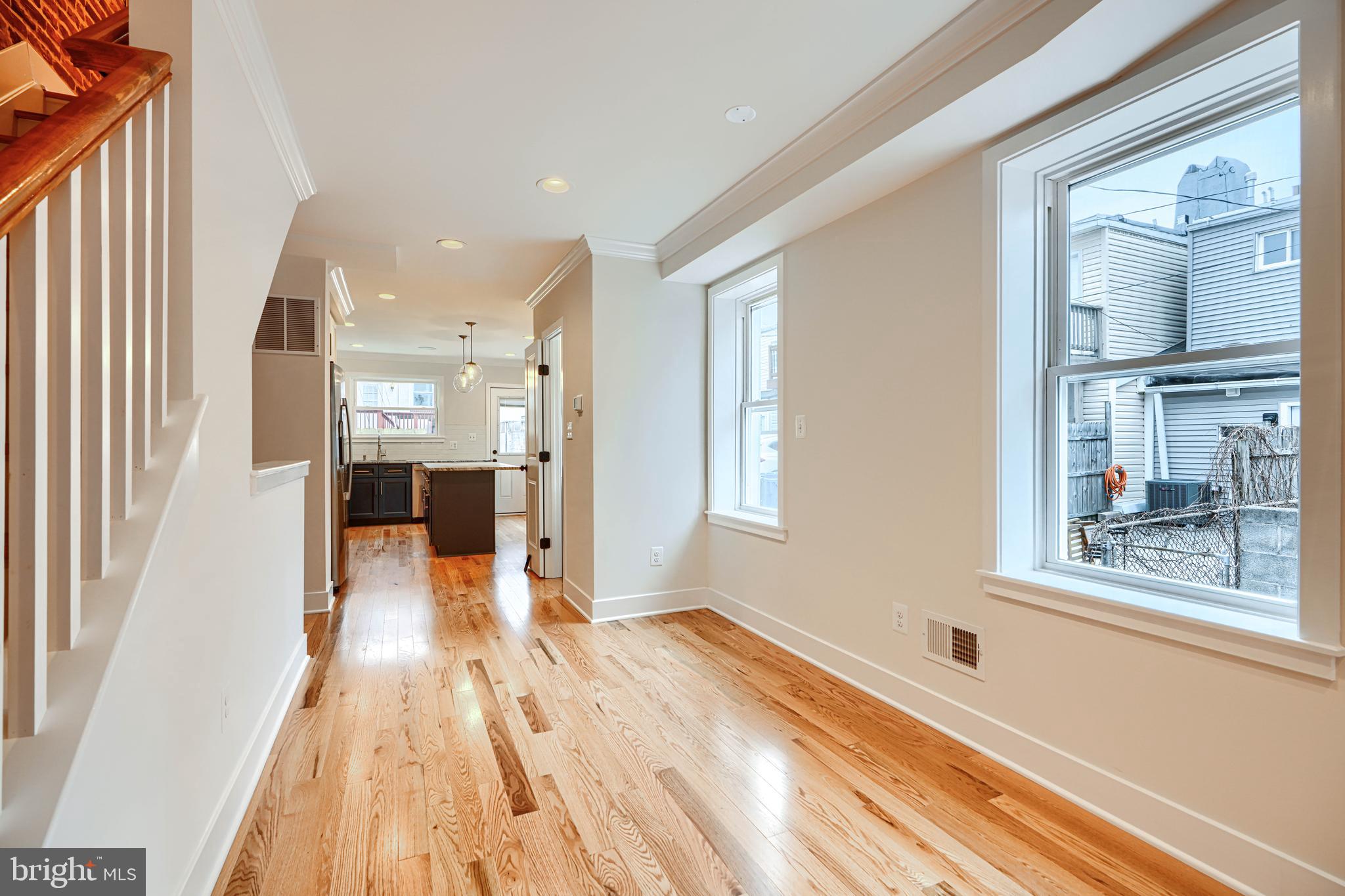 719 South Robinson Street Baltimore, MD 21224 - Photo 7 of 31 workspace with wooden floor and windows