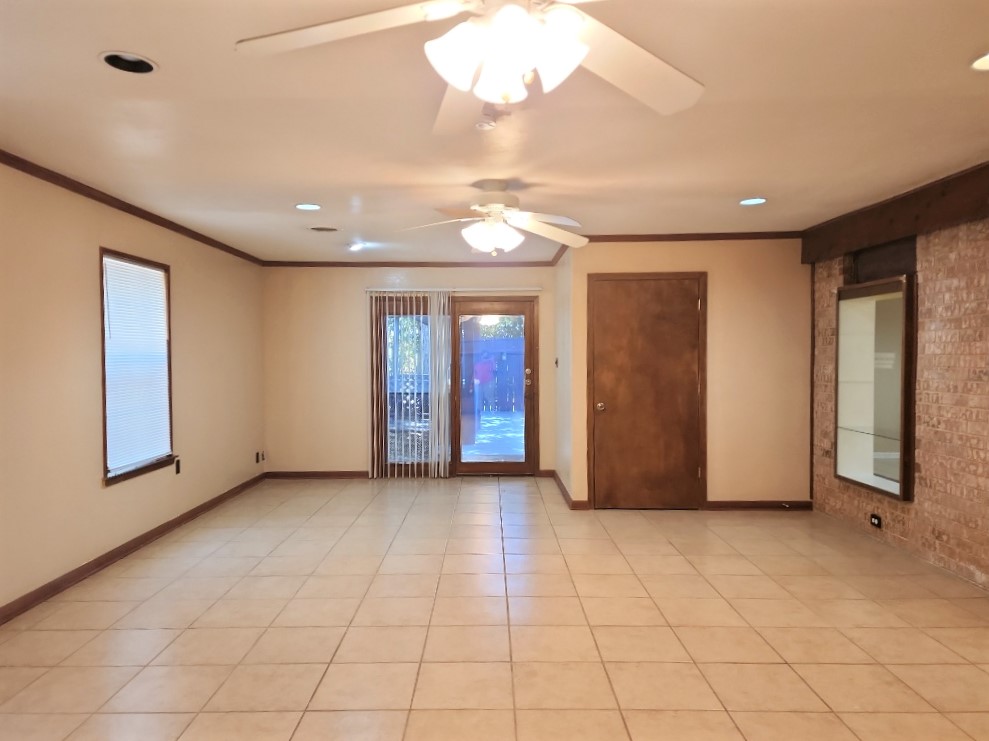 807 Country Club Road Georgetown, TX 78628 - Photo 14 of 31 Spare room with crown molding, light tile patterned flooring, and recessed lighting