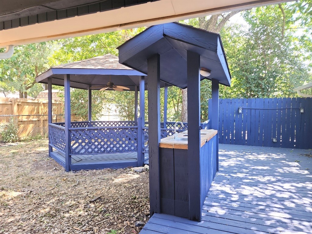 807 Country Club Road Georgetown, TX 78628 - Photo 15 of 31 Wooden terrace featuring a gazebo and ceiling fan