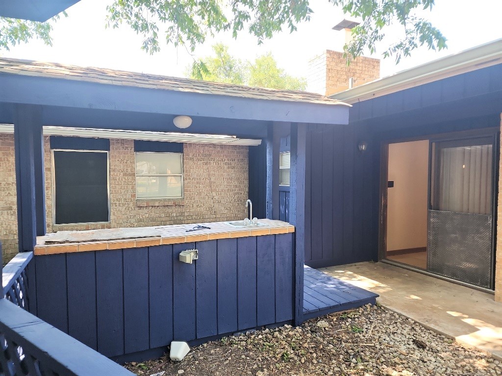 807 Country Club Road Georgetown, TX 78628 - Photo 18 of 31 View of patio / terrace with a jacuzzi and a wooden deck