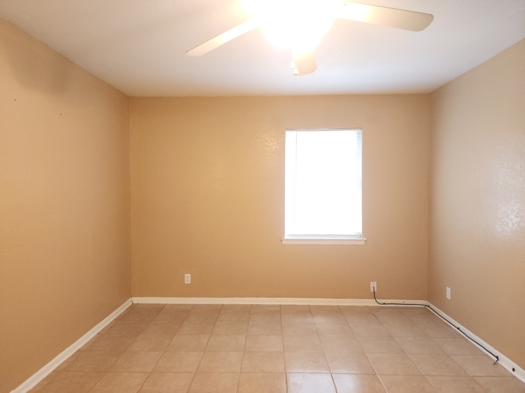 807 Country Club Road Georgetown, TX 78628 - Photo 24 of 31 Unfurnished room featuring light tile patterned floors and a ceiling fan
