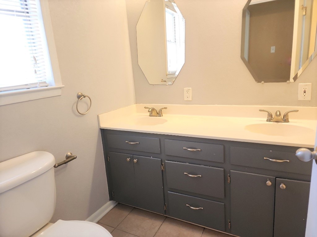 807 Country Club Road Georgetown, TX 78628 - Photo 30 of 31 Full bath featuring double vanity and light tile patterned floors