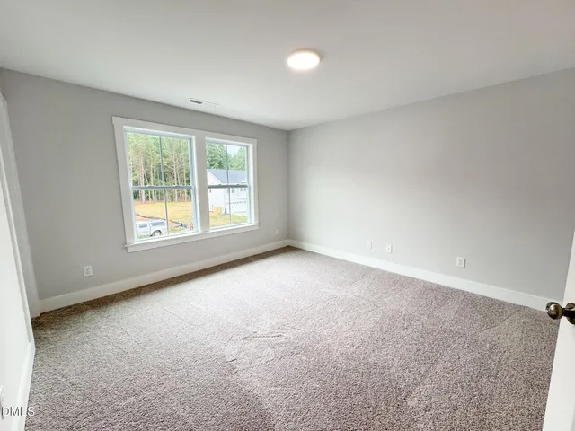 a bathroom with a granite countertop toilet and a shower