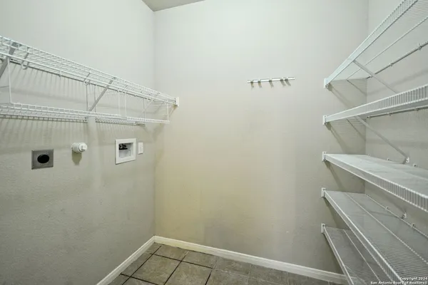 a bathroom with a shower and cabinets