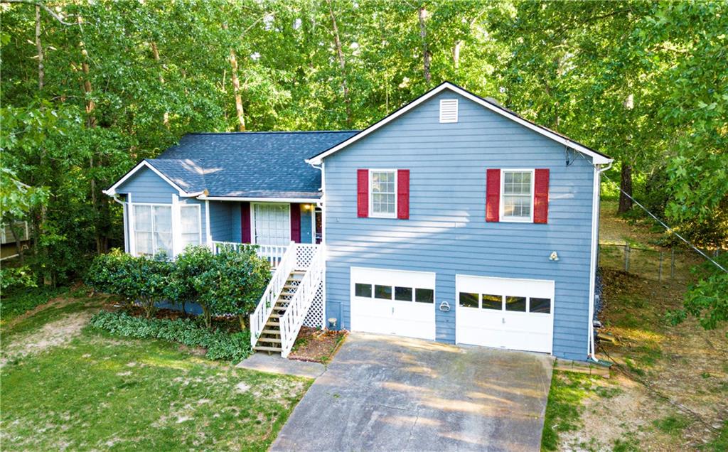 129 Spring Drive Hiram, GA 30141 - Photo 1 of 1 a front view of a house with garden