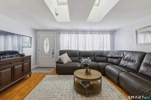 a living room with furniture and a rug