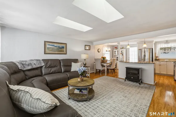 a living room with furniture a fireplace and a table