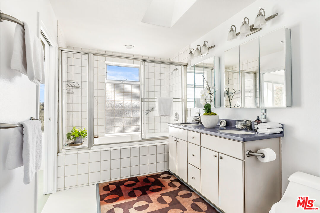 7401 Studio Road West Hills, CA 91304 - Photo 11 of 18 a kitchen with a sink a window and cabinets