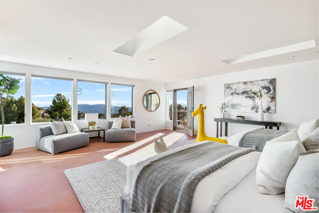 7401 Studio Road West Hills, CA 91304 - Photo 15 of 18 a bedroom with a large bed and a couch