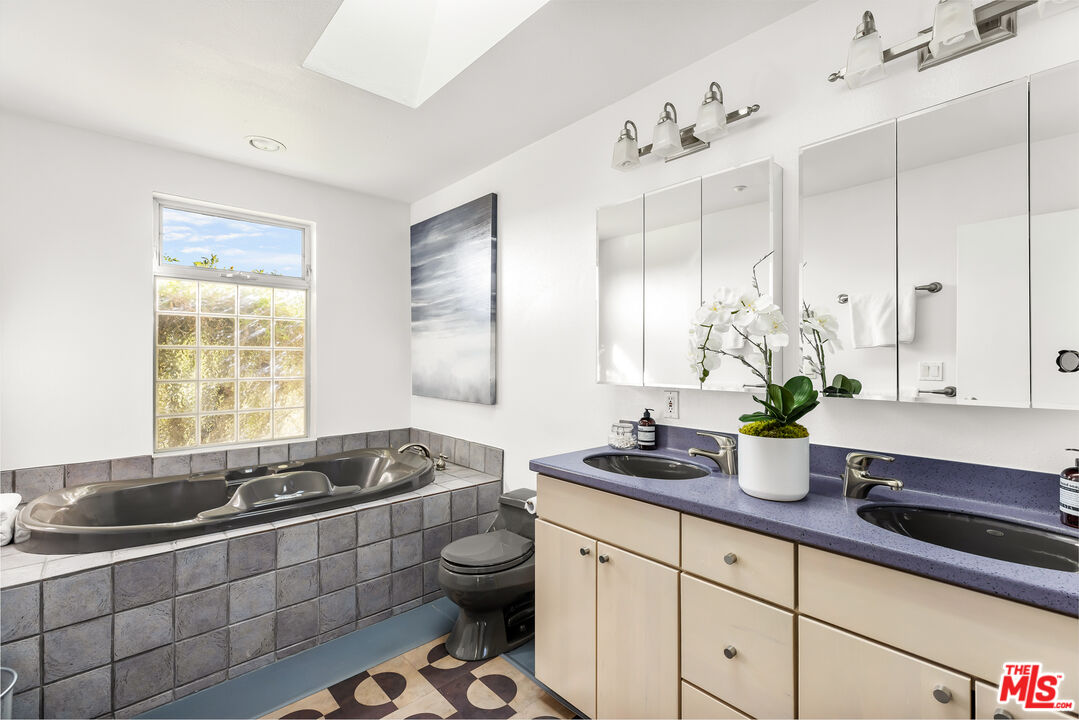 7401 Studio Road West Hills, CA 91304 - Photo 8 of 18 a kitchen with a sink stove and cabinets