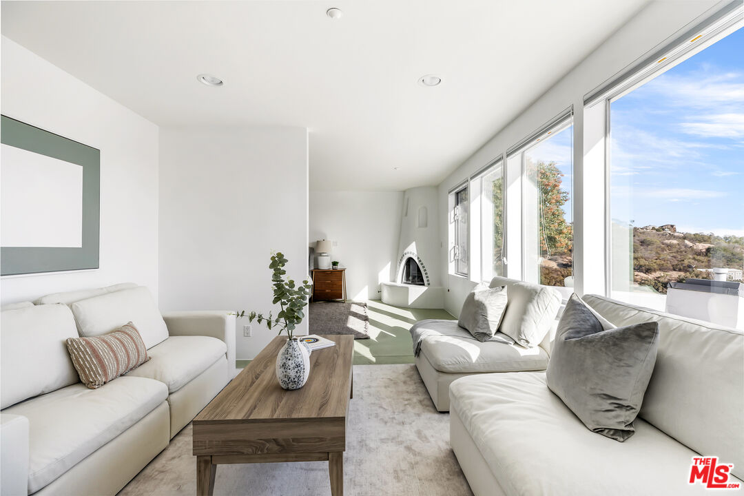 7401 Studio Road West Hills, CA 91304 - Photo 10 of 18 a living room with furniture and a large window