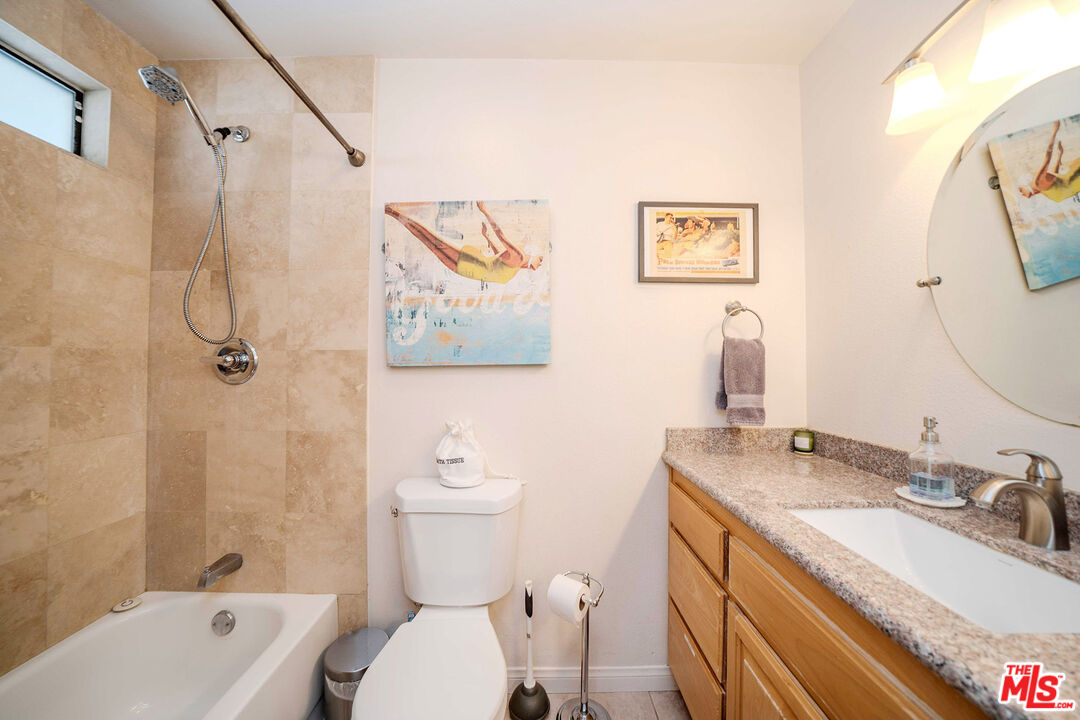 9524 Santa Cruz Road Desert Hot Springs, CA 92240 - Photo 26 of 53 a bathroom with a granite countertop sink toilet and shower