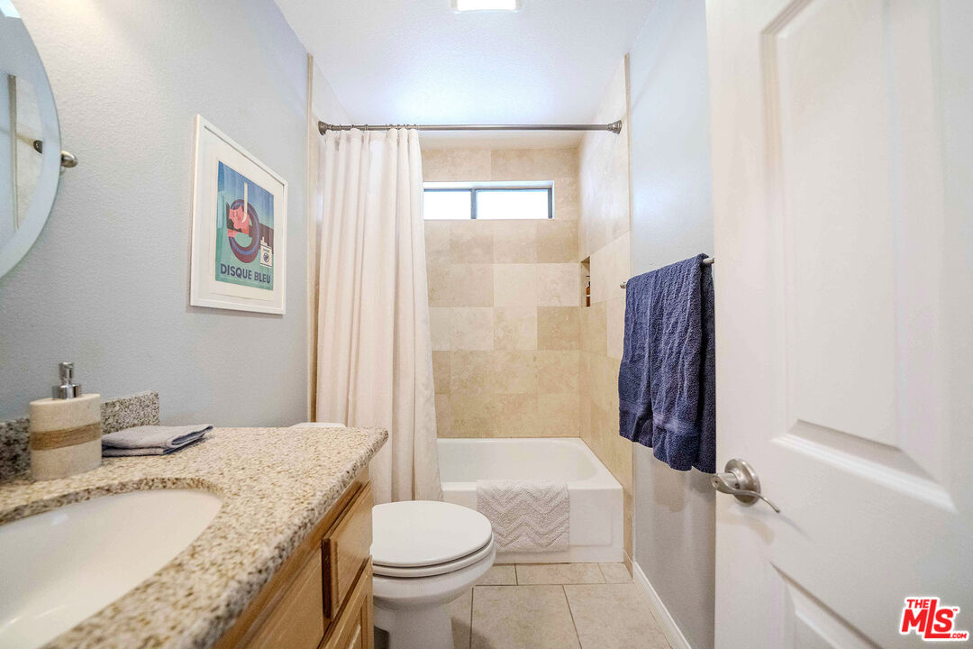 9524 Santa Cruz Road Desert Hot Springs, CA 92240 - Photo 27 of 53 a bathroom with a granite countertop sink toilet and shower