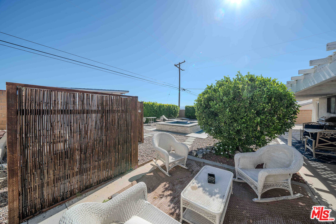 9524 Santa Cruz Road Desert Hot Springs, CA 92240 - Photo 36 of 53 a balcony with table and chairs