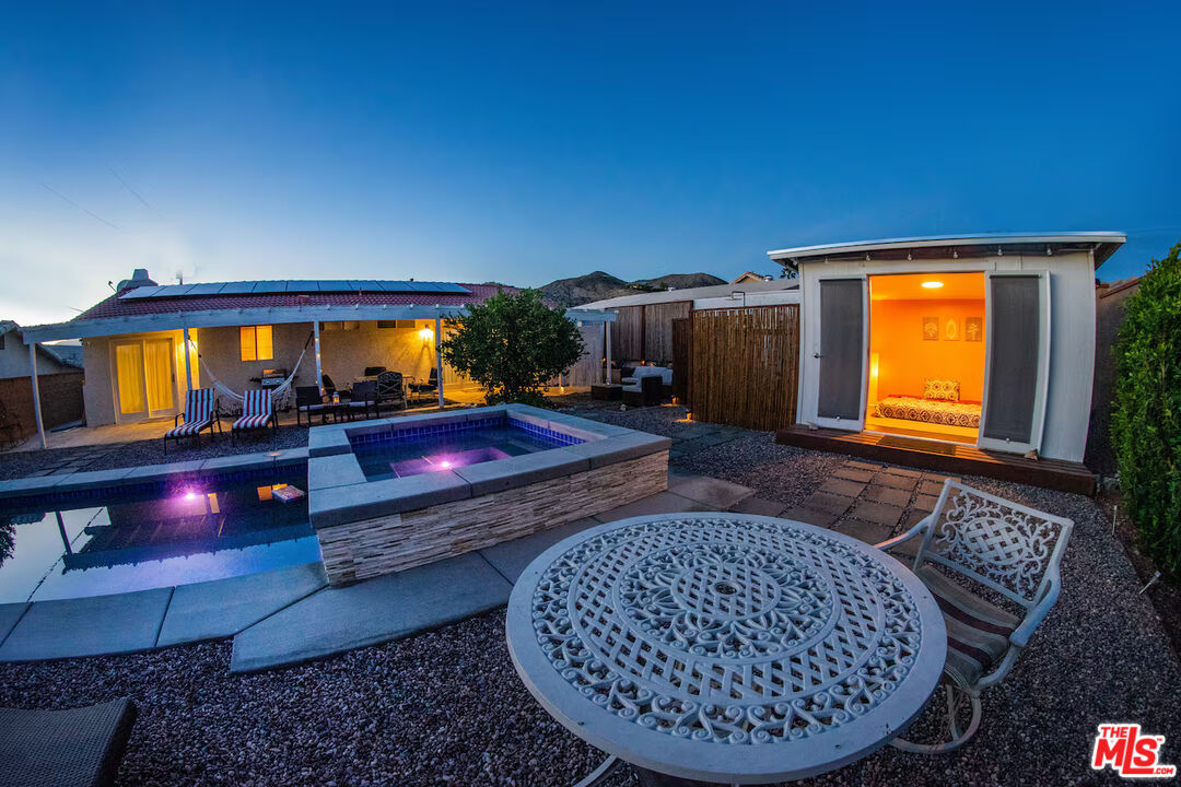 9524 Santa Cruz Road Desert Hot Springs, CA 92240 - Photo 44 of 53 a living room with furniture and a fireplace