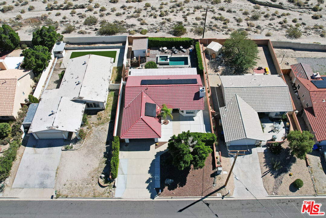 9524 Santa Cruz Road Desert Hot Springs, CA 92240 - Photo 6 of 53 an aerial view of residential houses with outdoor space