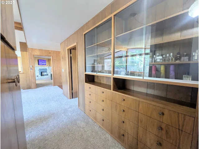 a kitchen with counter top space and windows